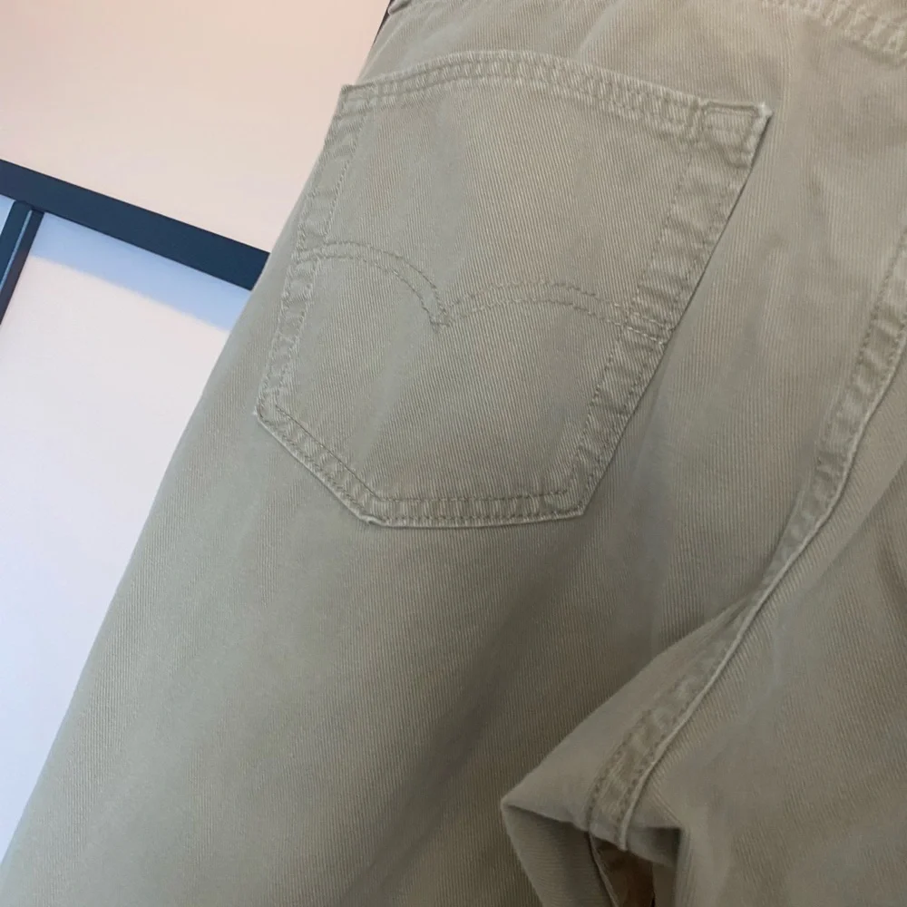 Levi's 502 tan pants. Size 36. HEMMED‎